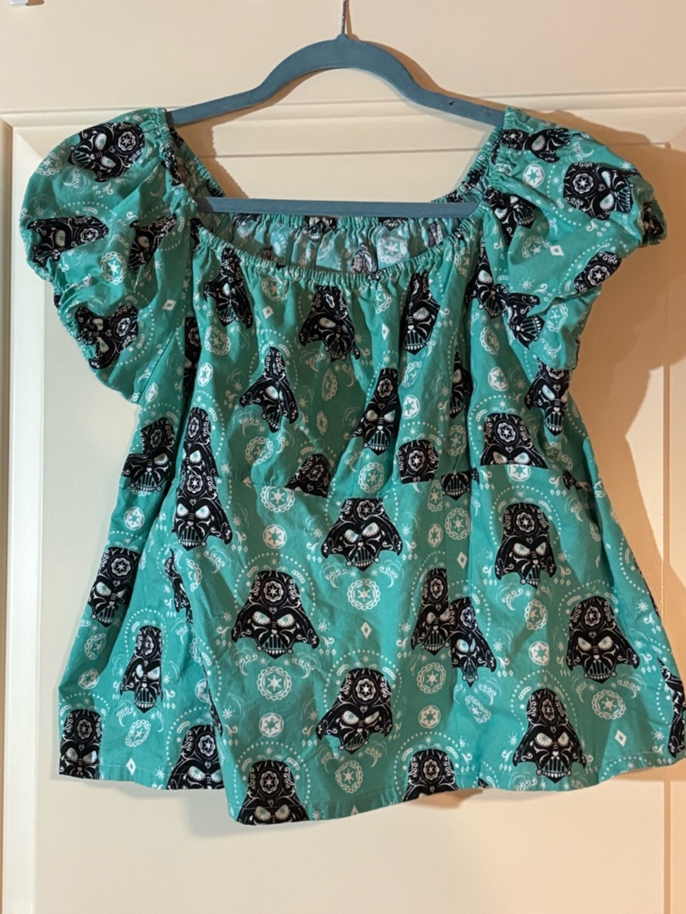 Turquoise Off-Shoulder Top with Black Graphic Star Wars Print